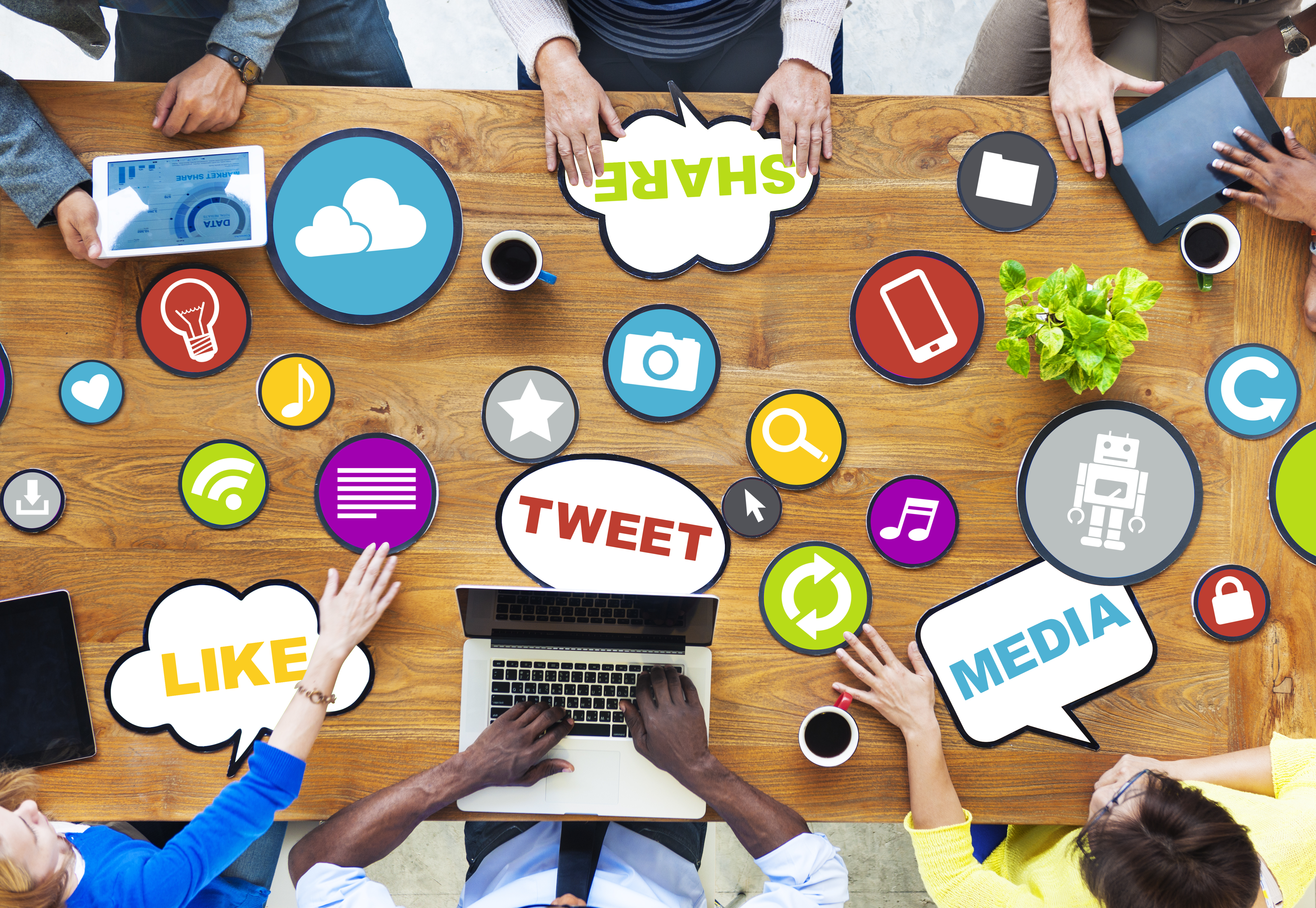 Multiple people in office on multiple devices
